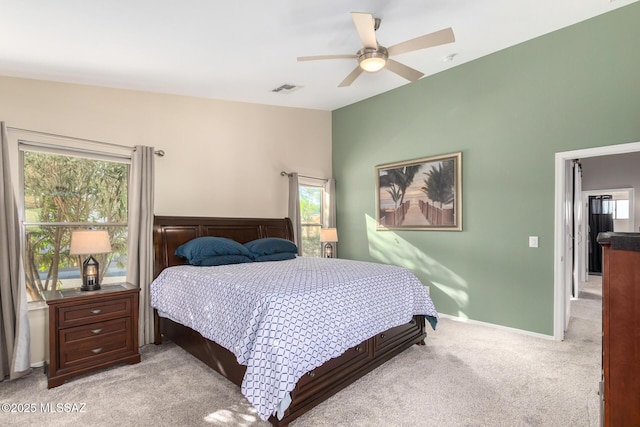 bedroom with ceiling fan and light colored carpet