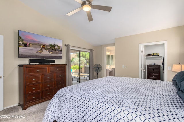 carpeted bedroom with ceiling fan, ensuite bath, vaulted ceiling, and access to outside