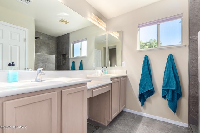 bathroom with walk in shower and vanity