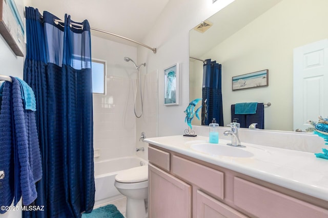 full bathroom featuring vanity, tile patterned floors, toilet, and shower / bath combo with shower curtain