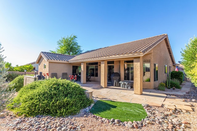 back of house featuring a patio