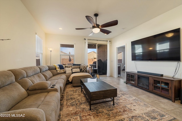 tiled living room featuring ceiling fan