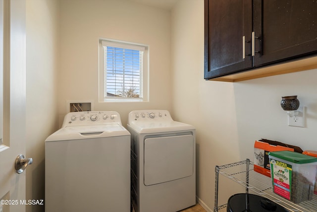 laundry room featuring cabinets and independent washer and dryer