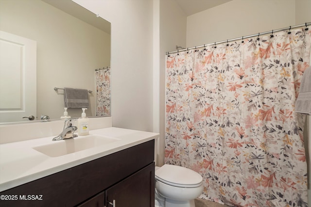 bathroom with a shower with curtain, vanity, and toilet