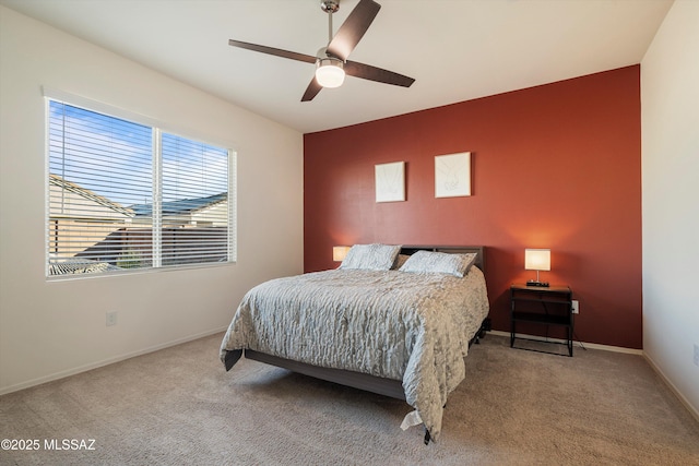 bedroom with ceiling fan and carpet floors