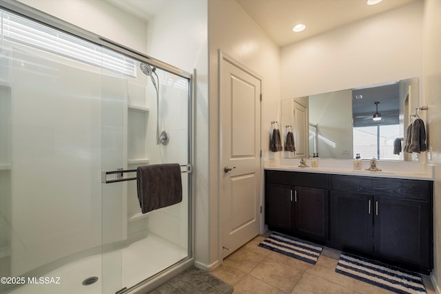 bathroom featuring vanity, an enclosed shower, and tile patterned floors