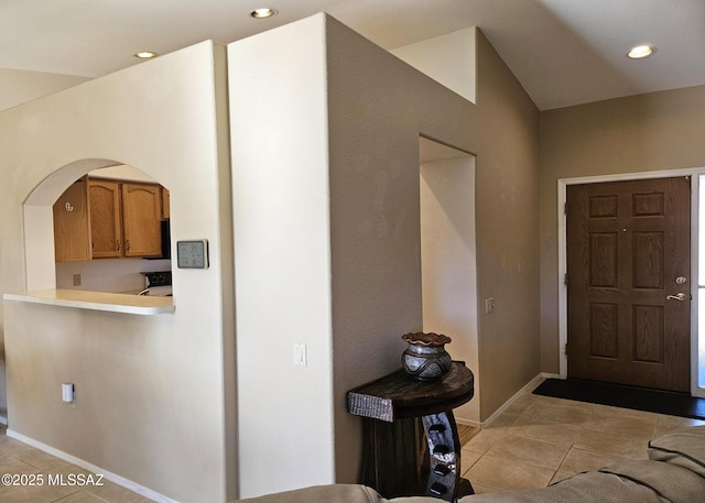 entrance foyer featuring light tile patterned flooring