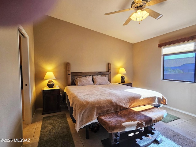 bedroom with ceiling fan and light tile patterned floors