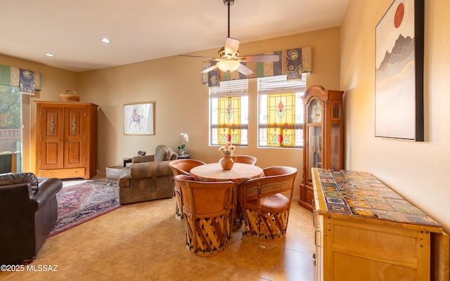 dining room featuring recessed lighting, light tile patterned floors, a ceiling fan, and plenty of natural light