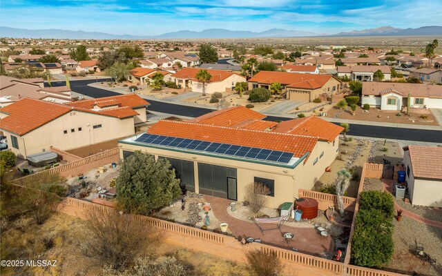 drone / aerial view with a residential view and a mountain view