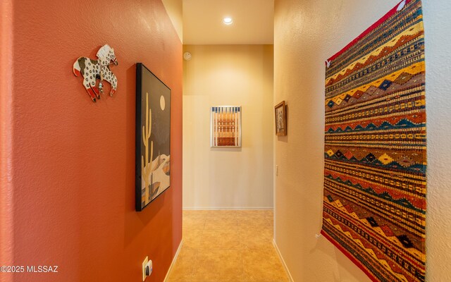 hallway with baseboards and recessed lighting
