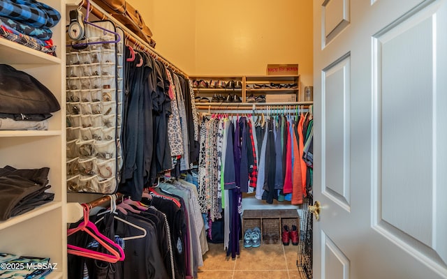 walk in closet featuring tile patterned flooring