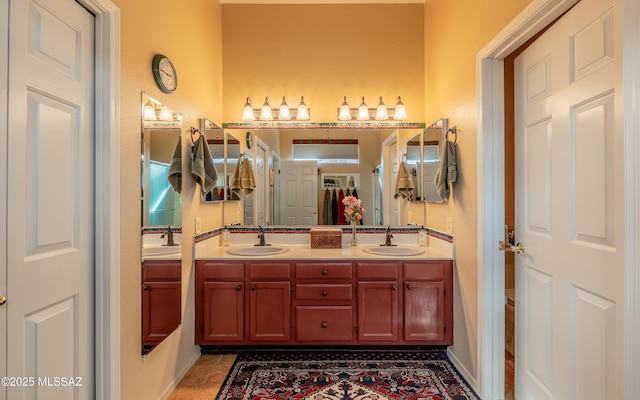 bathroom featuring vanity, tile patterned flooring, and toilet