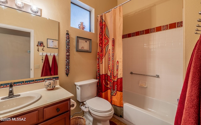 full bathroom with toilet, shower / bath combination with curtain, a textured wall, and vanity