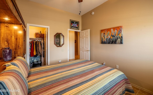 bedroom featuring a spacious closet, a high ceiling, and a closet