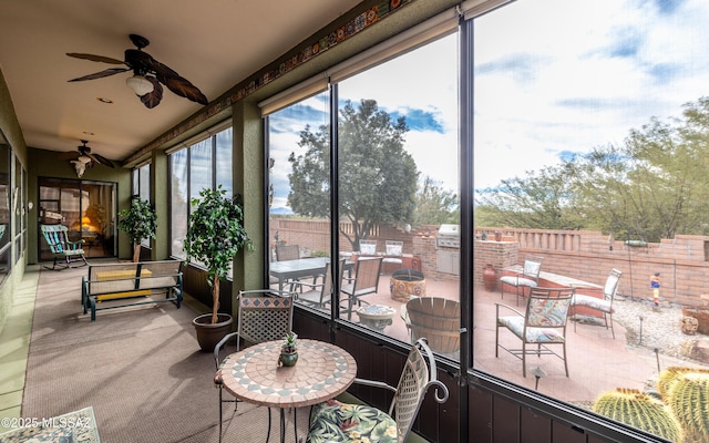 sunroom / solarium with ceiling fan