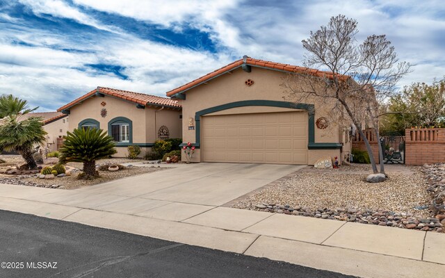 mediterranean / spanish-style home with a garage