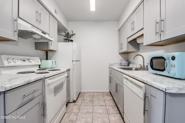 kitchen with sink, white appliances, gray cabinetry, and light tile patterned flooring