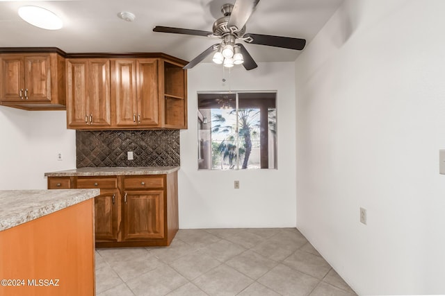 kitchen with backsplash and ceiling fan