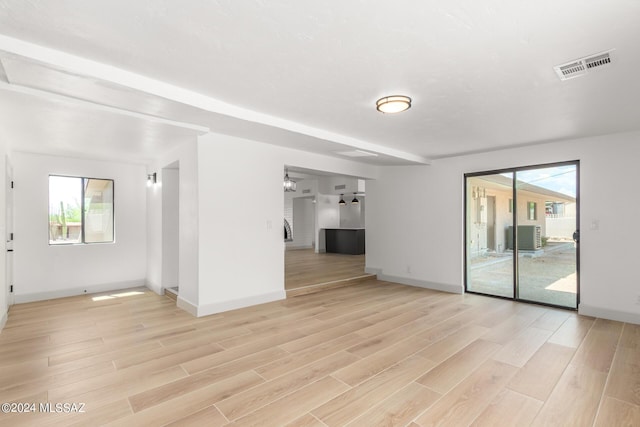 unfurnished room with light wood-type flooring