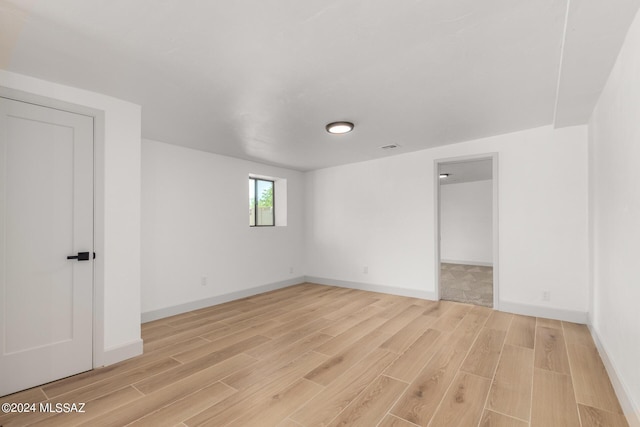 unfurnished room featuring light wood-type flooring