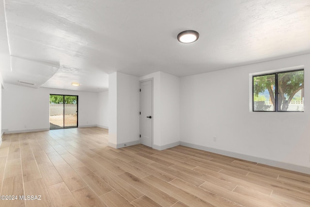 spare room featuring light wood-type flooring