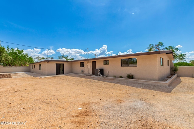 back of property with cooling unit