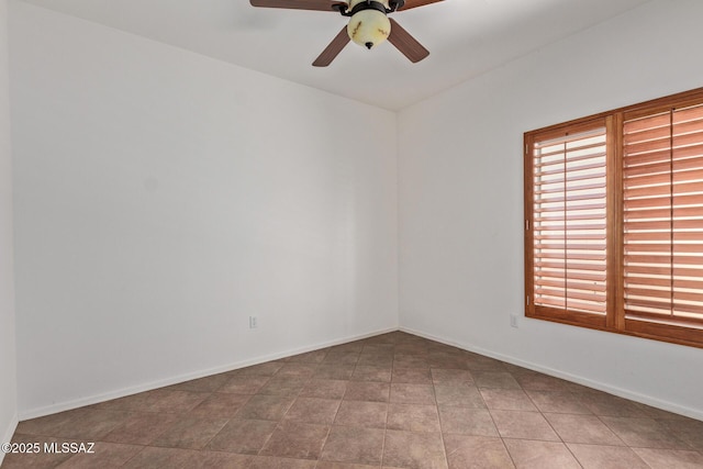 spare room with ceiling fan