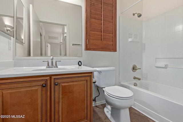 full bathroom featuring vanity, tile patterned floors, bathing tub / shower combination, and toilet