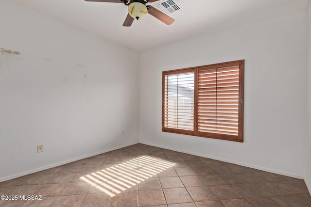 unfurnished room featuring ceiling fan and light tile patterned floors