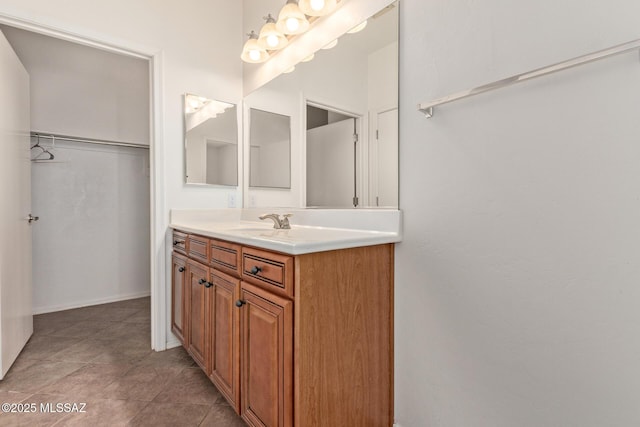 bathroom with tile patterned flooring and vanity