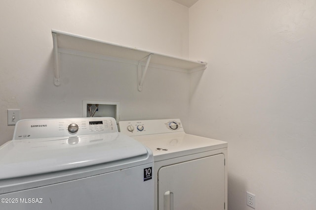 laundry room with washer and dryer