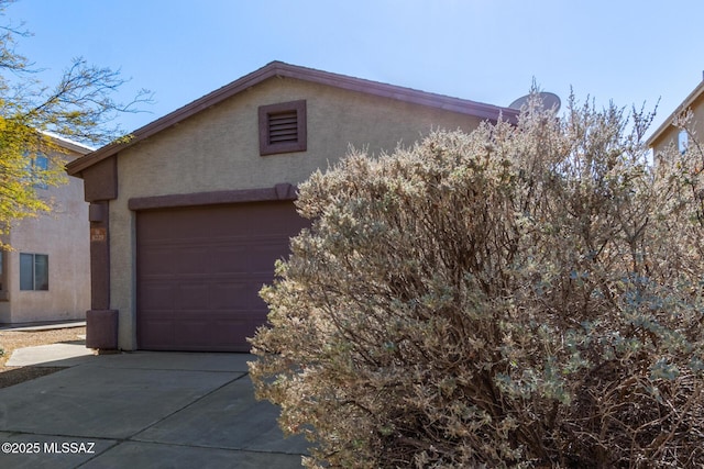 view of property exterior with a garage and an outdoor structure