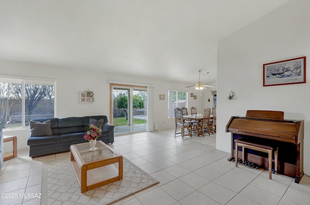 living room with ceiling fan and light tile patterned floors