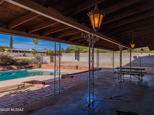 view of patio featuring a fenced in pool