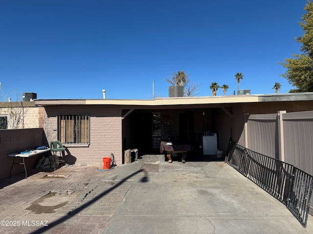 rear view of house with cooling unit and a patio area