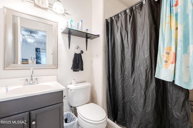 bathroom featuring vanity, a shower with curtain, and toilet