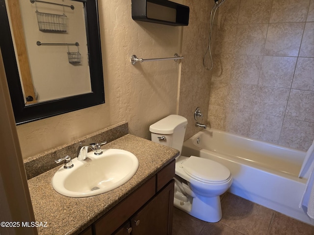 full bathroom with shower / tub combination, vanity, tile patterned floors, and toilet