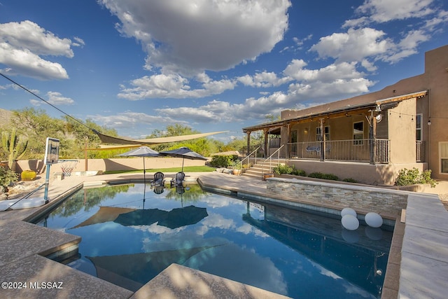 view of swimming pool featuring a patio