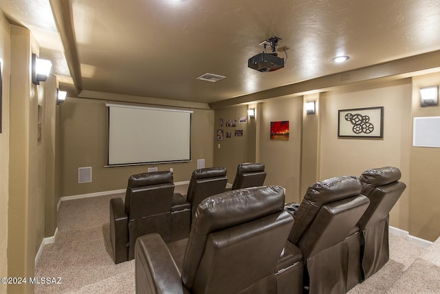 home theater room with light carpet, visible vents, and baseboards