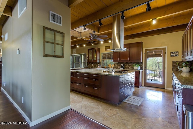 kitchen with visible vents, a kitchen island, wood ceiling, decorative backsplash, and island range hood