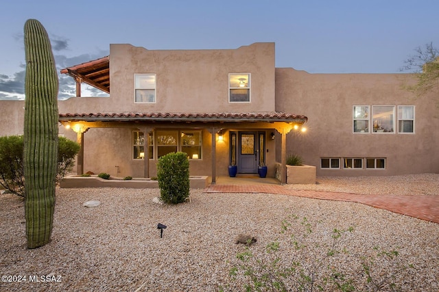 back of property with stucco siding