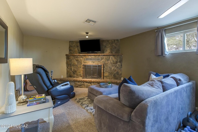 living room featuring visible vents, carpet, and a fireplace