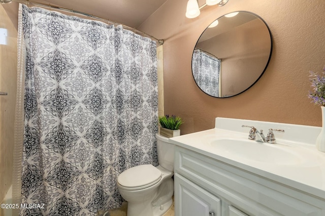 bathroom with vanity, toilet, and a shower with shower curtain