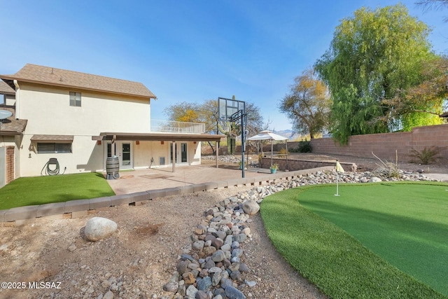 back of property featuring a patio