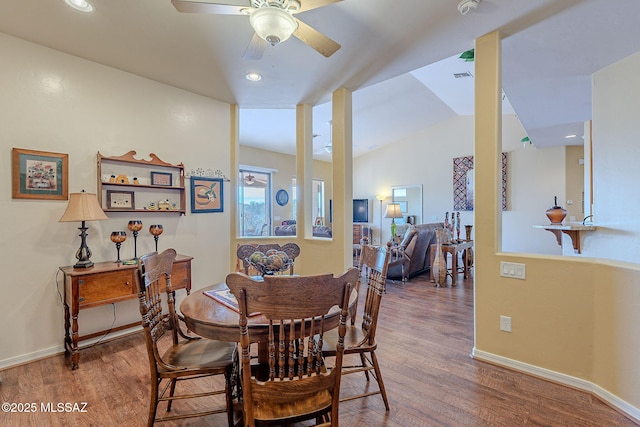 dining area with lofted ceiling, hardwood / wood-style floors, and ceiling fan