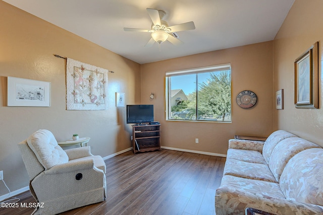 living room featuring ceiling fan and hardwood / wood-style floors