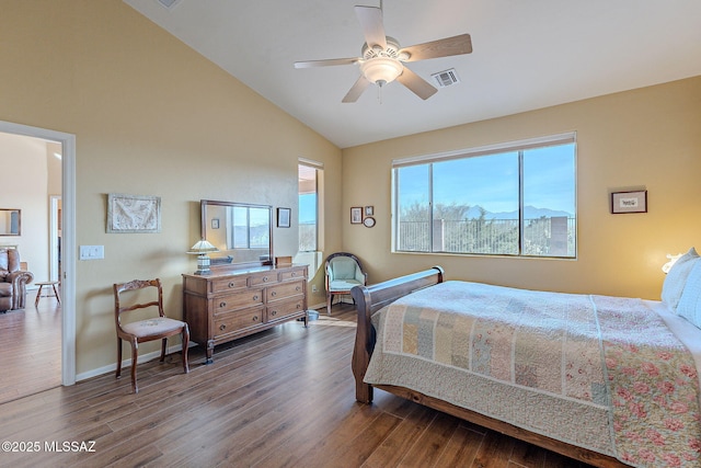 bedroom with ceiling fan, lofted ceiling, a mountain view, and hardwood / wood-style floors