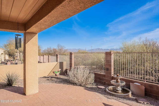 view of patio with a mountain view