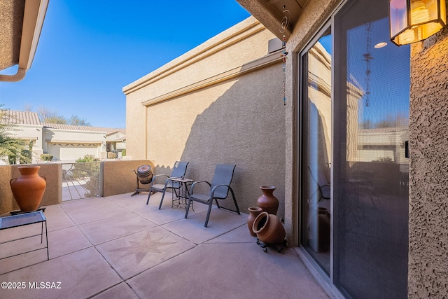 view of patio with a balcony